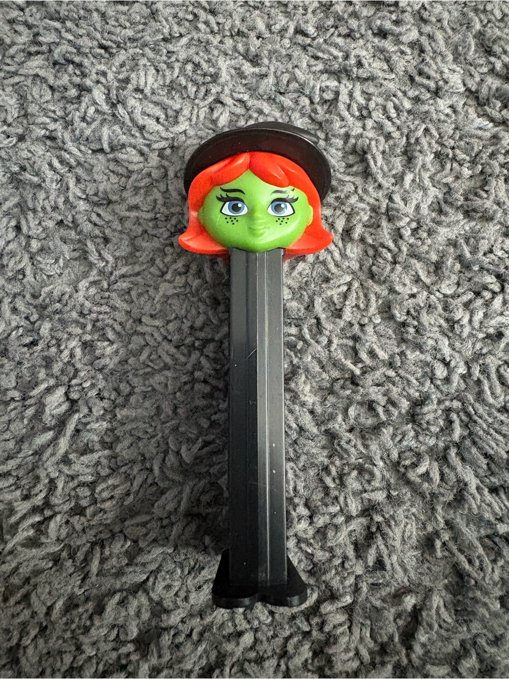 NWOT green faced red haired witch with a black base PEZ Dispenser